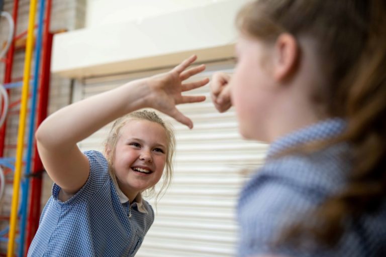 Key stage 2 pupils play fight during a drama workshop about the Anglo Saxons