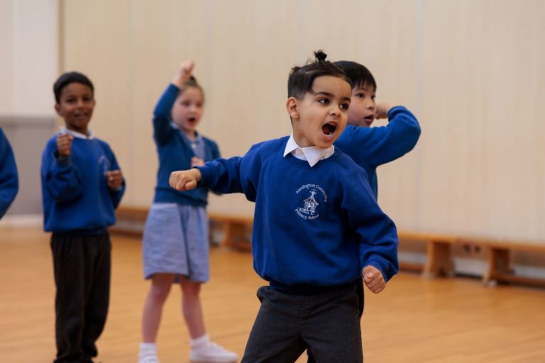 Key stage 1 pupils enjoy a Knights and Castles drama workshop in their school hall
