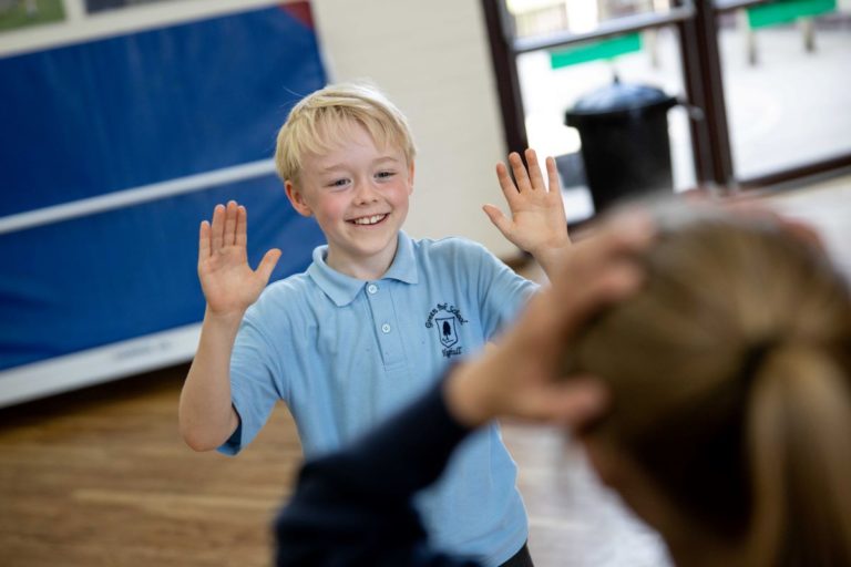 Primary pupils taking part in a Stone Age to Iron age drama workshop