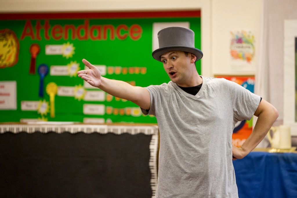 actor performing in top hat in school production