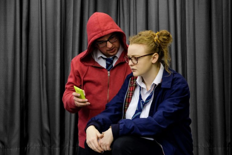 School drama workshop performers exploring the theme of refugees and asylum seeker awareness